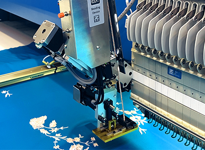 ZSK beading device for embroidering beads and pearls